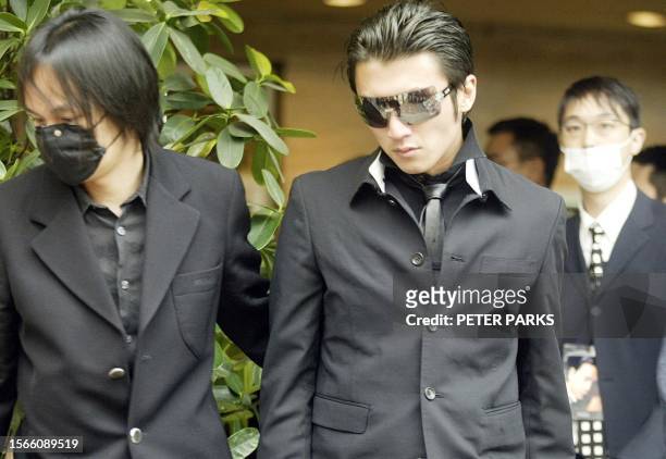 Canto pop star Nicholas Tse leaves the funeral service for Hong Kong actor and singer Leslie Cheung 08 April 2003. Stars packed the funeral for...