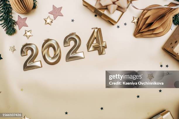 golden new year background 2024, gifts, branches of the christmas tree confetti - january holiday sale stock-fotos und bilder