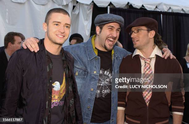 Bandmembers Justin Timberlake , Joey Fatone and J.C. Chasez arrive for the 30th Annual American Music Awards in Los Angeles 13 January 2003. AFP...