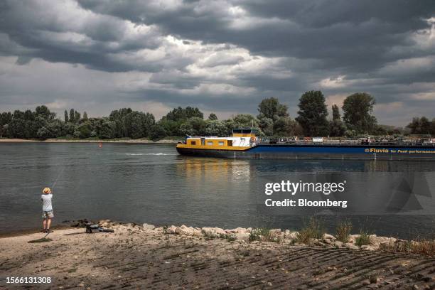 Fluvia HH GmbH bulk carrier barge sails along the Rhine River in Nierstein, Germany, on Wednesday, July 19, 2023. With water regularly receding to...