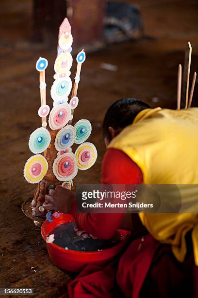 monks prepare offering - bhutan monk stock pictures, royalty-free photos & images