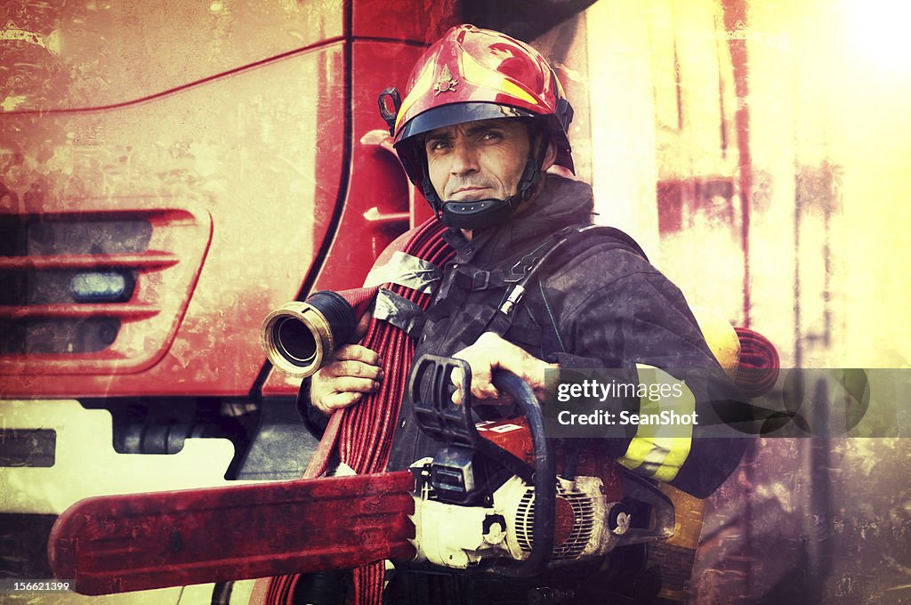 Firefighter with chainsaw and fire hose in the Wings