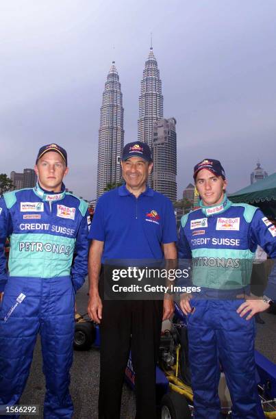 Kimi Raikkonen of Finland, Peter Sauber and Nick Hiedfeld of Germany and the Sauber formula pose in front of the Petronas Towers in Malaysia, in...