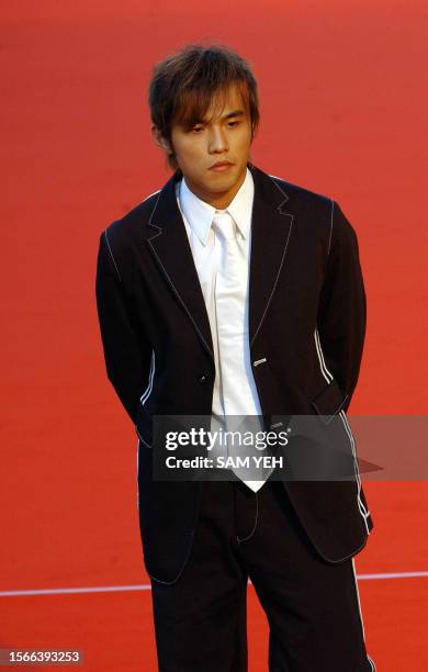 Taiwan pop singer Jay Chou poses for a photo before the 14th Golden Melody Awards in Taipei 02 August, 2003. More then 50 Taiwan, Hong Kong and...