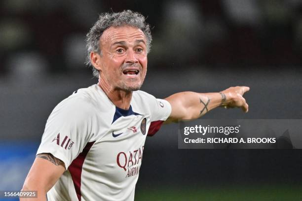 Paris Saint-Germain's Spanish head coach Luis Enrique gestures during a training session one day before the football friendly match between Italy's...