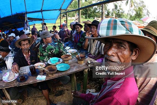 Retired and active jockeys gather at a coffee shop before a ''Pacu Jawi,'' a cow race, on November 17, 2012 in Batusangkar, Indonesia. The ''Pacu...