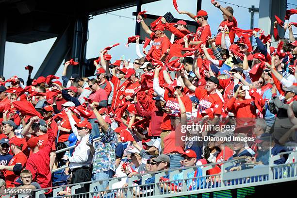 Fans in the rightfield seats stand and wave their Nats towels prior to the start of Game Three of the National League Division Series on October 10,...