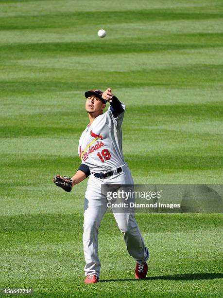 Outfielder Jon Jay of the St. Louis Cardinals warms up in the outfield prior to the bottom of the first inning of Game Three of the National League...