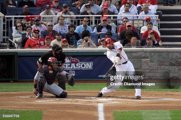 Outfielder Jayson Werth of the Washington Nationals singles to lead off the bottom of the first inning of Game Three of the National League Division...