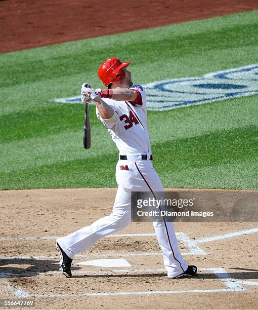 Outfielder Bryce Harper of the Washington Nationals flies out to the leftfielder during the bottom of the third inning of Game Three of the National...