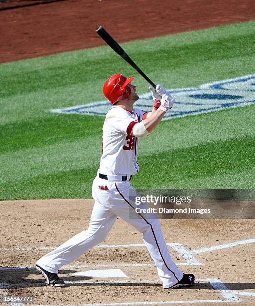 Outfielder Bryce Harper of the Washington Nationals flies out to the leftfielder during the bottom of the third inning of Game Three of the National...