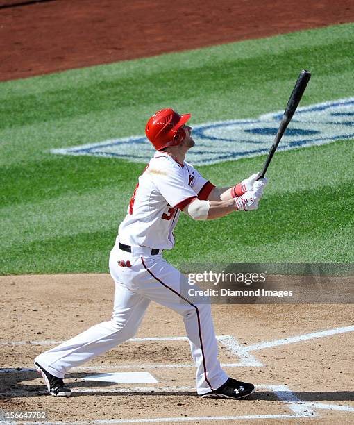 Outfielder Bryce Harper of the Washington Nationals flies out to the leftfielder during the bottom of the third inning of Game Three of the National...