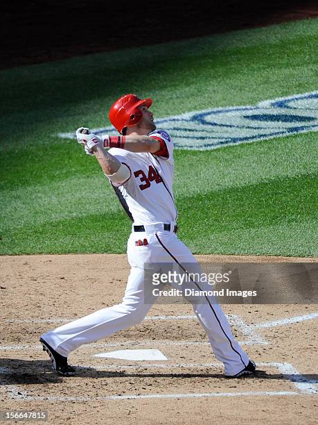Outfielder Bryce Harper of the Washington Nationals pops out to the shortstop during the bottom of the fifth inning of Game Three of the National...