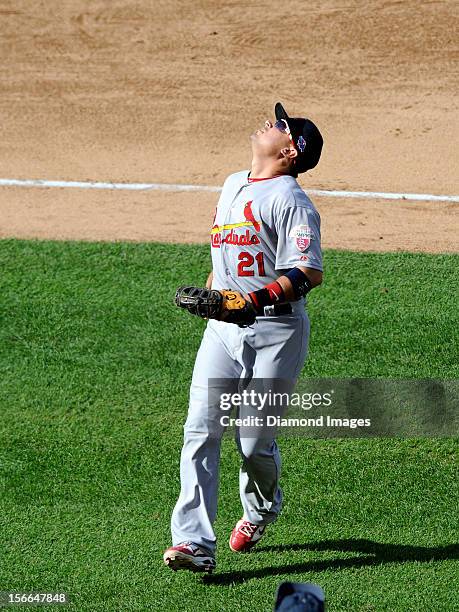 Firstbaseman Allen Craig of the St. Louis Cardinals gets into position to field a pop fly ball off the bat of outfielder Jayson Werth of the...