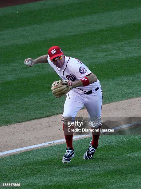 Thirdbaseman Ryan Zimmerman of the Washington Nationals charges towards homeplate to field a ground ball off the bat of outfielder Matt Holliday of...