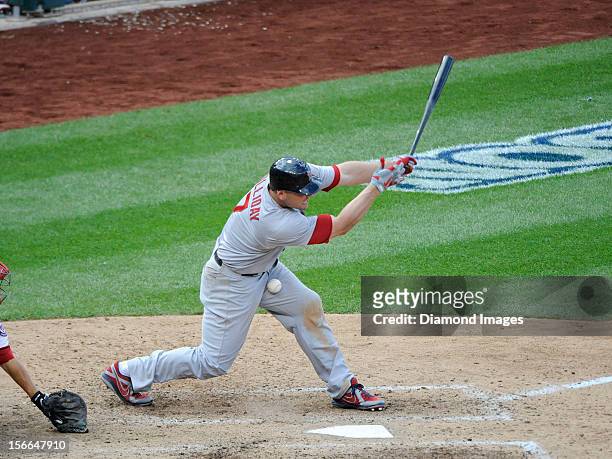 Outfielder Matt Holliday of the St. Louis Cardinals fouls a pitch off of his left leg during the top of the eighth inning of Game Three of the...