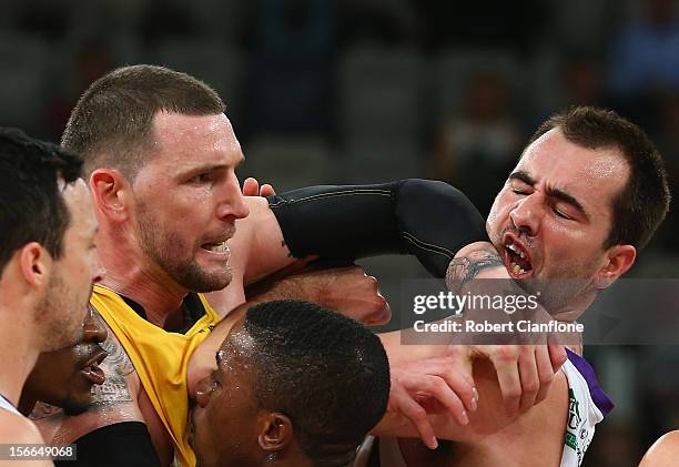 Seth Scott of the Tigers elbows Ian Crosswhite of the Kings during the round seven NBL match between the Melbourne Tigers and the Sydney Kings at...