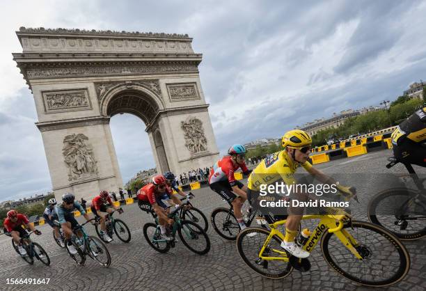 Jonas Vingegaard of Denmark and Team Jumbo-Visma - Yellow Leader Jersey and a general view of the peloton passing close The Arc de Triomf during the...
