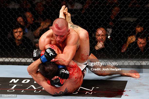 Georges St-Pierre grapples against Carlos Condit in their welterweight title bout during UFC 154 on November 17, 2012 at the Bell Centre in Montreal,...