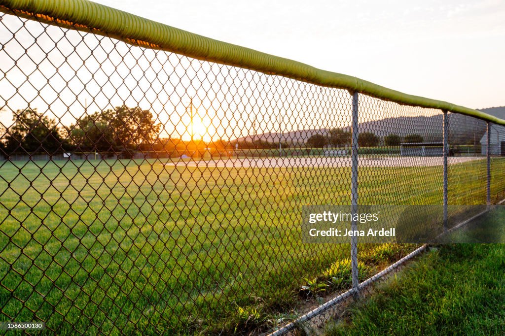 Public Baseball Field, School Sports Field with Chainlink Fence in Rural Small Town America