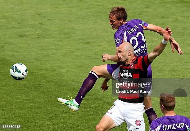 Michael Thwaite of the Glory and Dino Kresinger of the Wanderers contest for the ball during the round seven A-League match between Perth Glory and...