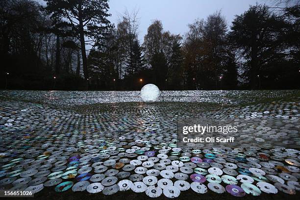 The art installation by Bruce Munro entitled 'Blue Moon on a Platter', made up of thousands of used CDs, forms part of the Christmas decorations at...