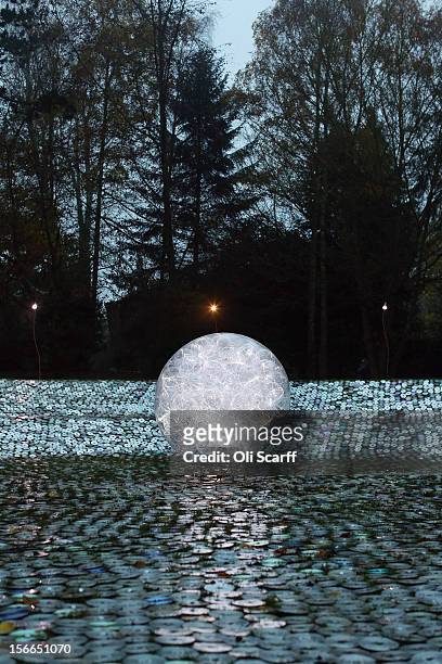 The art installation by Bruce Munro entitled 'Blue Moon on a Platter', made up of thousands of used CDs, forms part of the Christmas decorations at...
