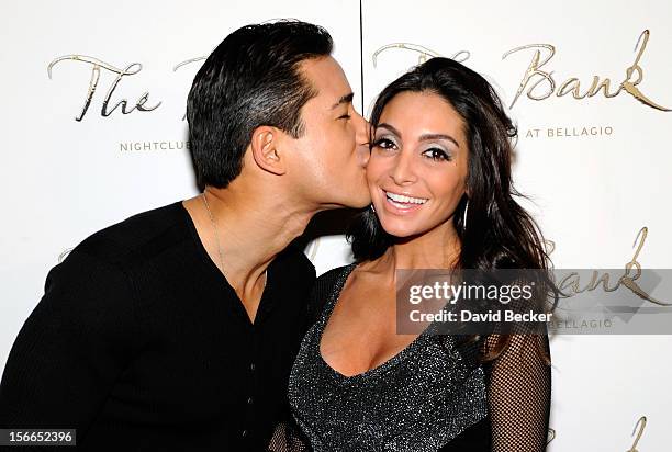 Television personality Mario Lopez and his fiancee Courtney Mazza arrive at Mazza's bachelorette party at The Bank Nightclub at the Bellagio on...