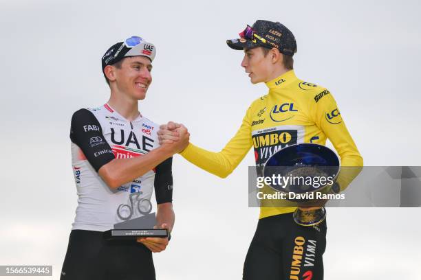 Tadej Pogacar of Slovenia and UAE Team Emirates on second place and race winner Jonas Vingegaard of Denmark and Team Jumbo-Visma - Yellow Leader...