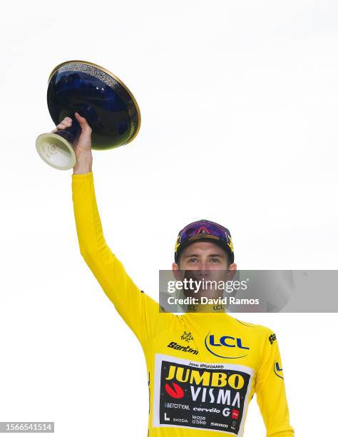 Jonas Vingegaard of Denmark and Team Jumbo-Visma - Yellow Leader Jersey celebrates at podium as final overall winner during the stage twenty-one of...