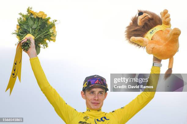 Jonas Vingegaard of Denmark and Team Jumbo-Visma - Yellow Leader Jersey celebrates at podium as final overall winner during the stage twenty-one of...