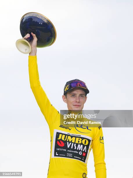 Jonas Vingegaard of Denmark and Team Jumbo-Visma - Yellow Leader Jersey celebrates at podium as final overall winner during the stage twenty-one of...