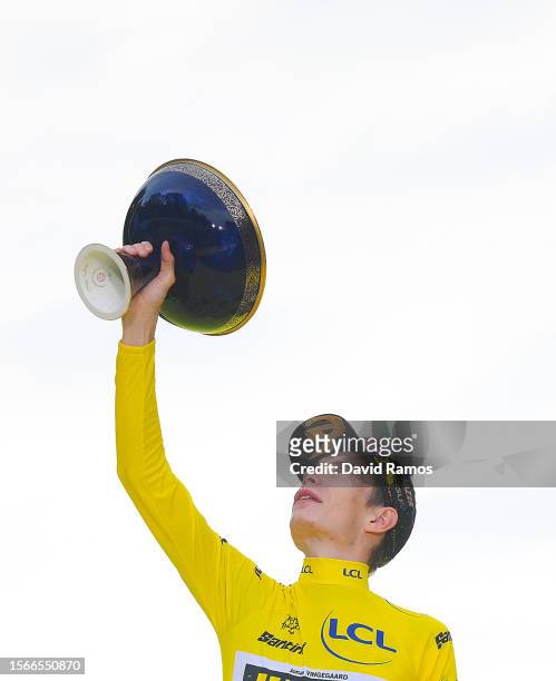 Jonas Vingegaard of Denmark and Team Jumbo-Visma - Yellow Leader Jersey celebrates at podium as final overall winner during the stage twenty-one of...