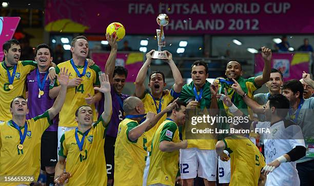 Vinicius of Brazil lifts the trophy after winning the FIFA Futsal World Cup Final at Indoor Stadium Huamark on November 18, 2012 in Bangkok, Thailand.