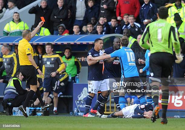 Luke Varney of Leeds is sent off by referee Mark Halsey for a foul on Adam Smith of Millwall, who lies injured on the ground during the npower...