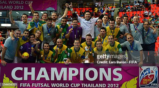 Players of Brazil celebrate with the trophy after winning the FIFA Futsal World Cup Final at Indoor Stadium Huamark on November 18, 2012 in Bangkok,...