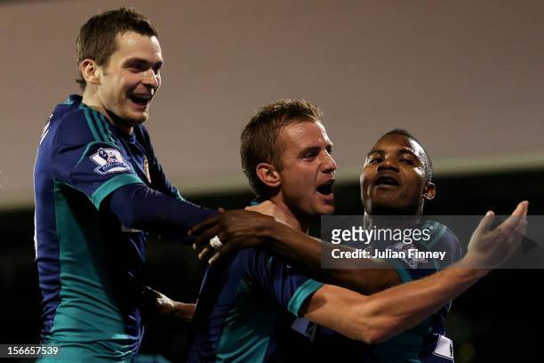 Stephane Sessegnon of Sunderland celebrates with teammates Adam Johnson and Lee Cattermole after scoring his team's third goal during the Barclays...