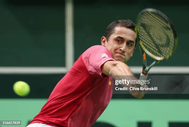 Nicolas Almagro of Spain plays a backhand against Radek Stepanek of Czech Republic during day three of the final Davis Cup match between Czech...