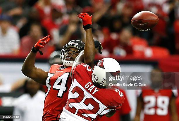 William Gay of the Arizona Cardinals breaks up a reception intended for Roddy White of the Atlanta Falcons that resulted in an interception at...