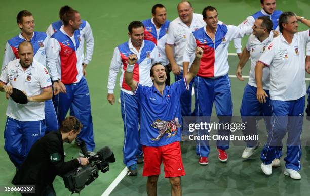 Radek Stepanek of Czech Republic celebrates with his team mates after celebrating match point against Nicolas Almagro of Spain during day three of...