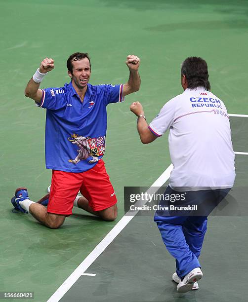 Radek Stepanek of Czech Republic celebrates after match point with Czech Republic team captain Jaroslav Navratil after his four set victory against...