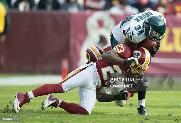 Philadelphia Eagles running back Bryce Brown is tackled by Washington Redskins cornerback DeAngelo Hall during the first half at FedEx Field in...