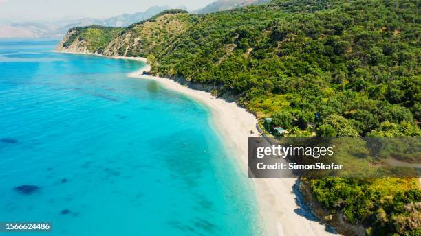 aerial view of coastline with hill and beach - albania stock pictures, royalty-free photos & images