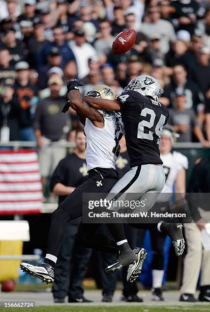 Michael Huff of the Oakland Raiders breaks up this pass to Marques Colston of the New Orleans Saints during the second quarter of their NFL football...