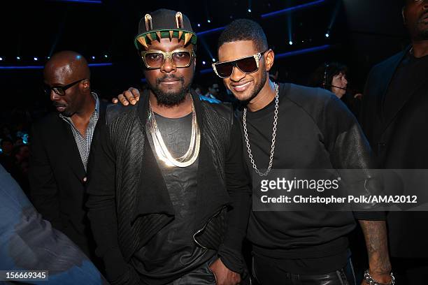 Recording artists will.i.am and Usher pose in the audience at the 40th American Music Awards held at Nokia Theatre L.A. Live on November 18, 2012 in...