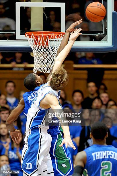 Eric McKnight of the Florida Gulf Coast Eagles blocks a shot by Alex Murphy of the Duke Blue Devils at Cameron Indoor Stadium on November 18, 2012 in...