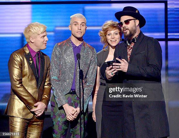 Musicians Chris Allen, Tyler Glenn, Elaine Bradley and Branden Campbell of Neon Trees speak onstage during the 40th American Music Awards held at...