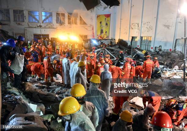 Rescuers work on site after the roof of a school gymnasium collapsed on July 23, 2023 in Qiqihar, Heilongjiang Province of China. The roof of a...