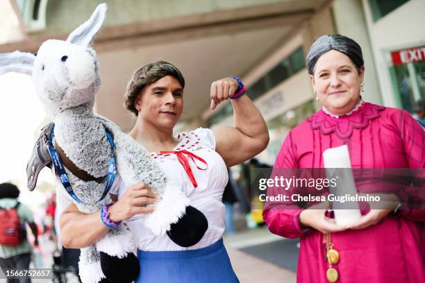 Cosplayers dressed as Luisa Madrigal and Alma Madrigal from "Encanto" are seen during 2023 Comic-Con International: San Diego on July 23, 2023 in San...