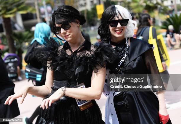 Cosplayers dressed as Wednesday Addams and Cruella de Vil pose during 2023 Comic-Con International: San Diego on July 23, 2023 in San Diego,...